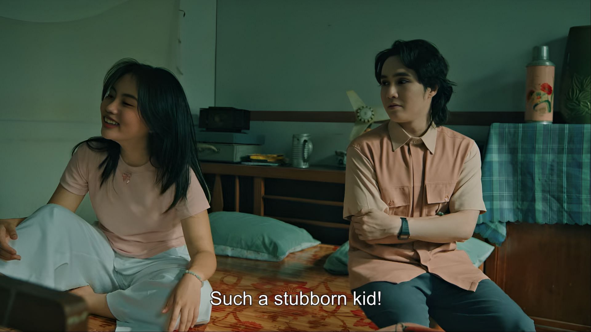 My Tien and Gia Minh share a moment of sibling banter in their childhood bedroom—one alive, one a ghost. (Image via Skyline Media)